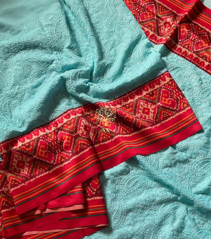 Aqua chikankari patola bordered sari