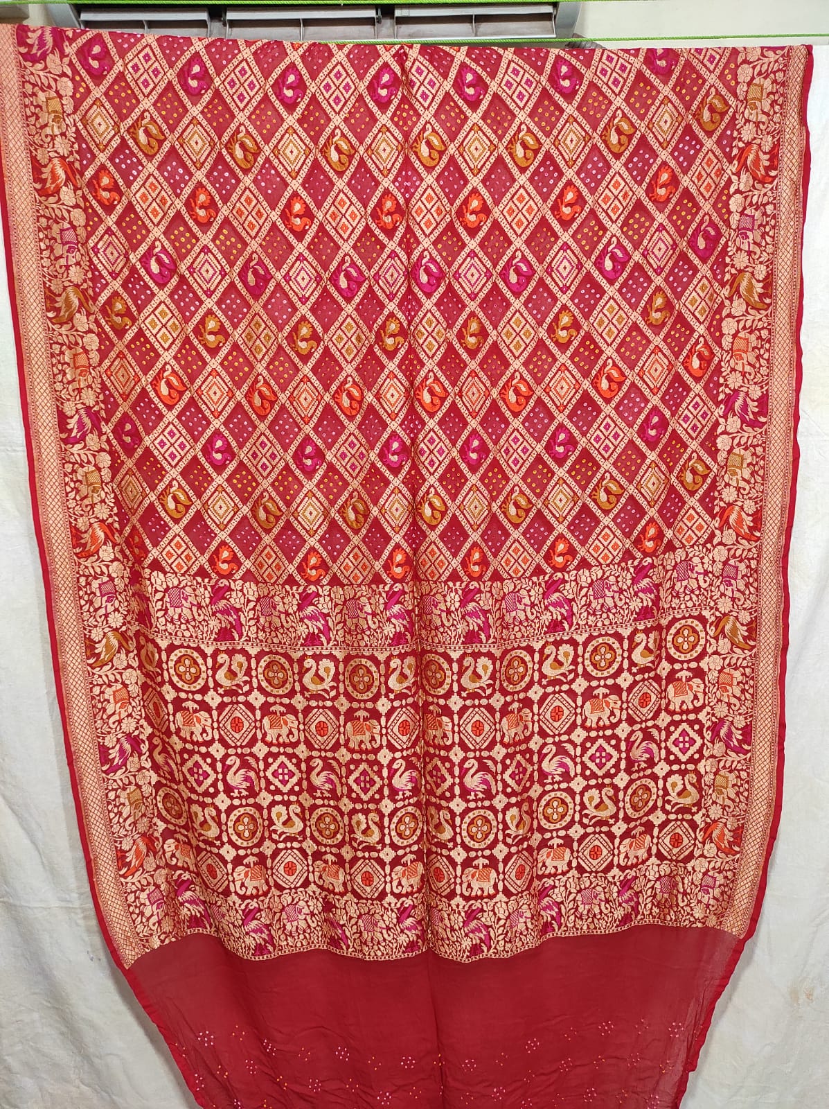 Gulmarg red bandhej saree