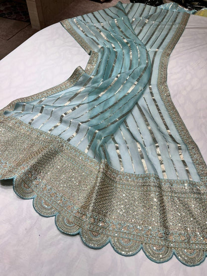 Arvenia striped organza saree