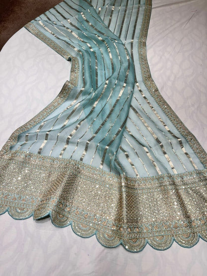 Arvenia striped organza saree