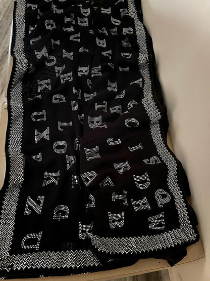 Alphabetic inspired black Swarovski saree