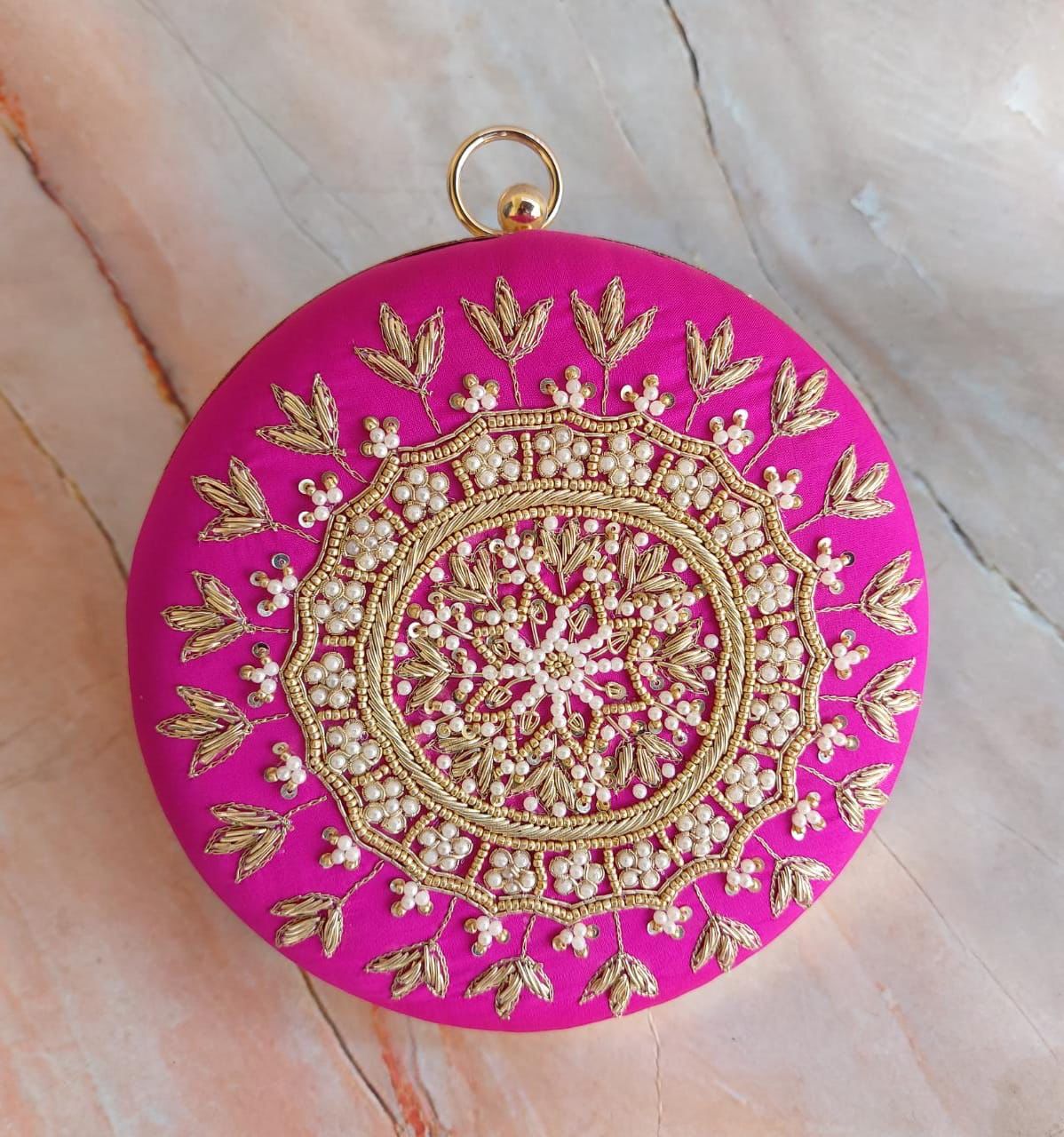 Round embroidery clutch